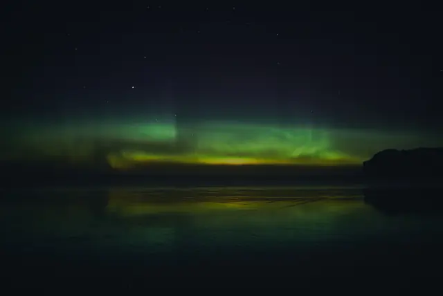 Aurora borealis in the night sky above Alaska