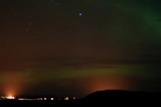 Aurora borealis in the night sky above Canada